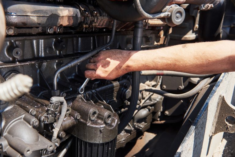 a mechanic checking car reconditioned cylinder head